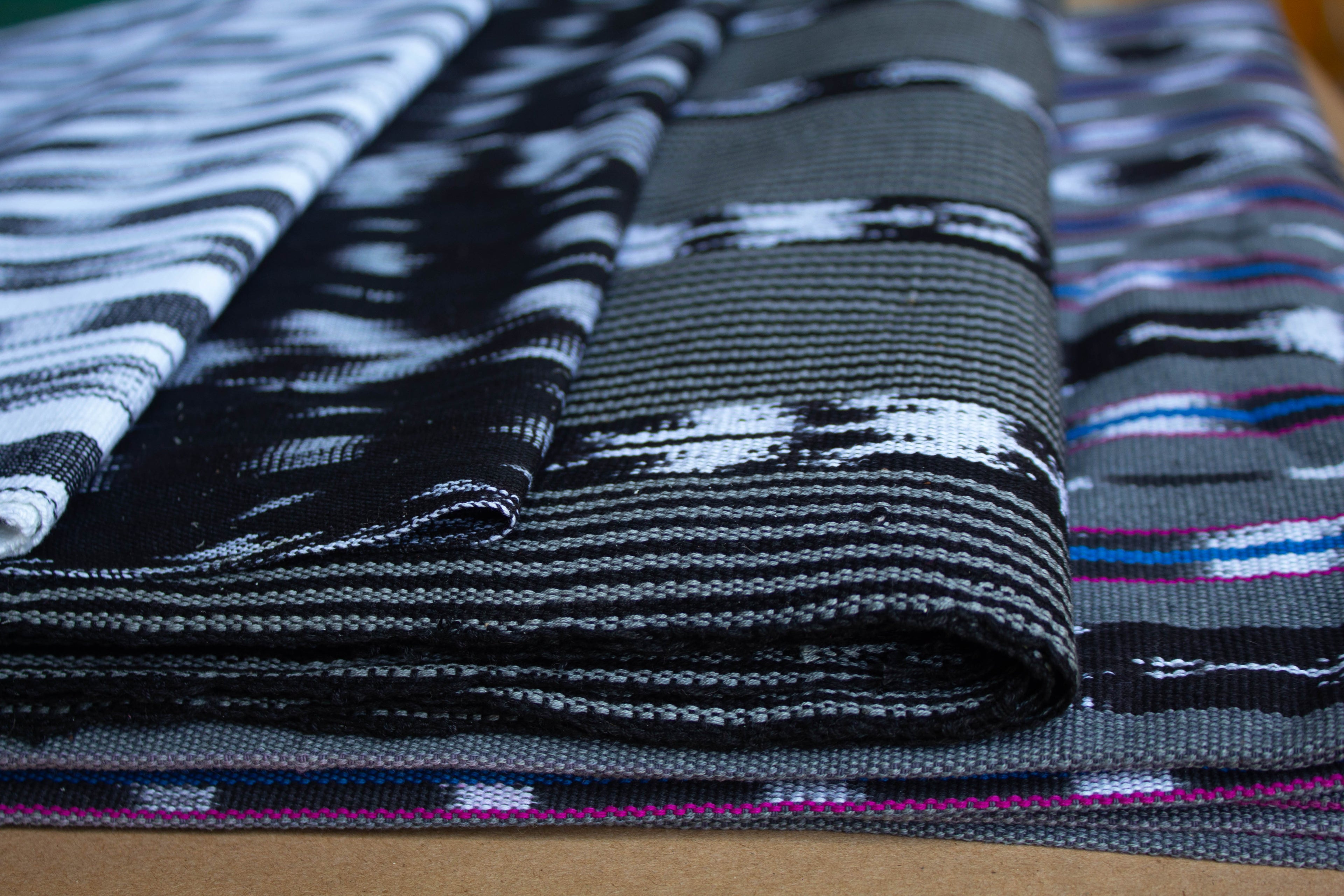 black and white artisan made handwoven textiles fabrics from Guatemala,  handmade bags, luxury handmade, handcrafted goods, handcrafted accessories, Guatemalan handbags